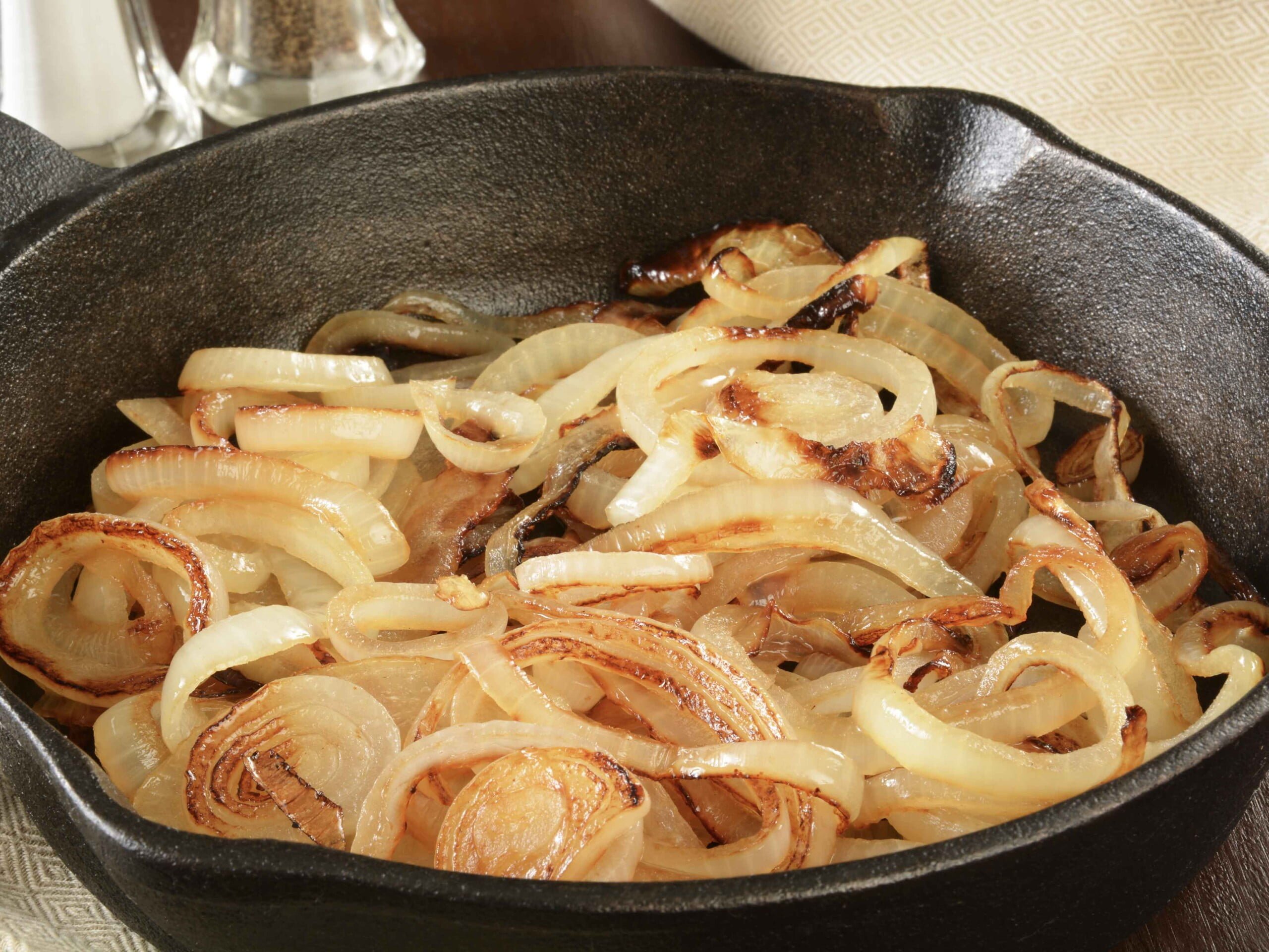 golden onion rings in pan